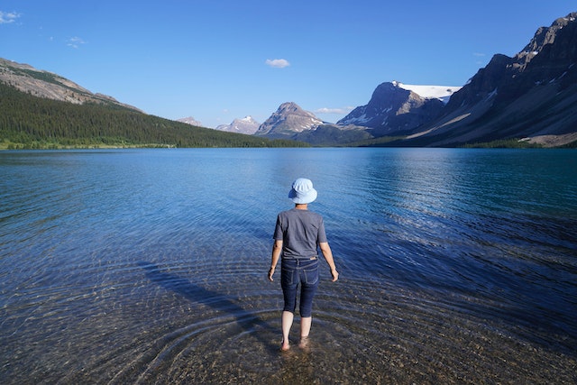 Photo by Hyukman Kwon: https://www.pexels.com/photo/a-person-wearing-a-hat-standing-on-the-lake-13375276/