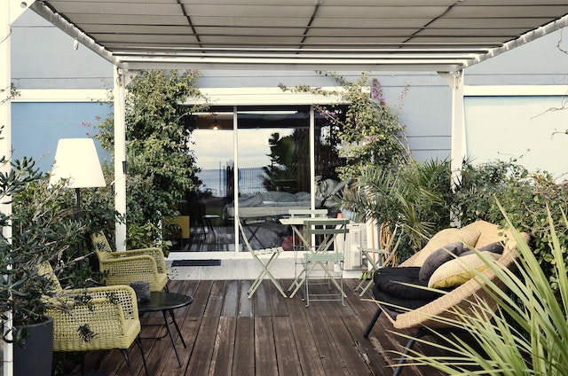 Photo by Skylar Kang: https://www.pexels.com/photo/backyard-of-modern-residential-villa-with-comfy-wicker-furniture-and-tropical-plants-6430734/