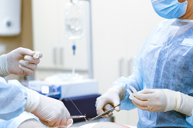 Photo by Anna Shvets: https://www.pexels.com/photo/photo-of-medical-professionals-wearing-personal-protective-equipment-4483327/