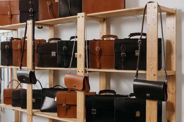 Photo by cottonbro studio: https://www.pexels.com/photo/leather-bags-on-wooden-shelves-6648416/
