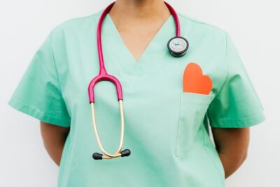 Photo by Karolina Grabowska: https://www.pexels.com/photo/a-stethoscope-hanging-on-medical-professional-s-neck-wearing-a-green-uniform-5207103/