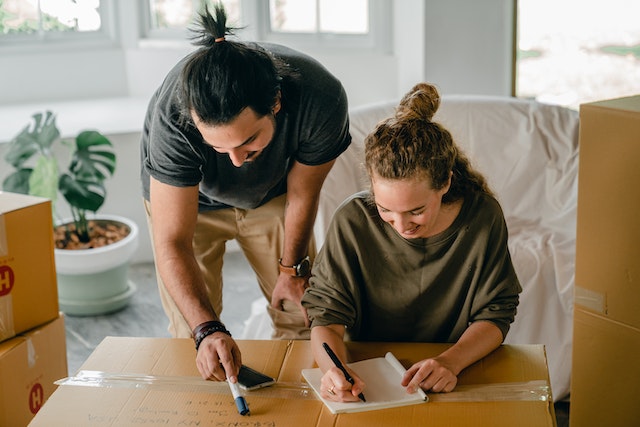 Photo by Ketut Subiyanto: https://www.pexels.com/photo/cheerful-diverse-couple-writing-in-notebook-near-boxes-before-relocation-4246197/