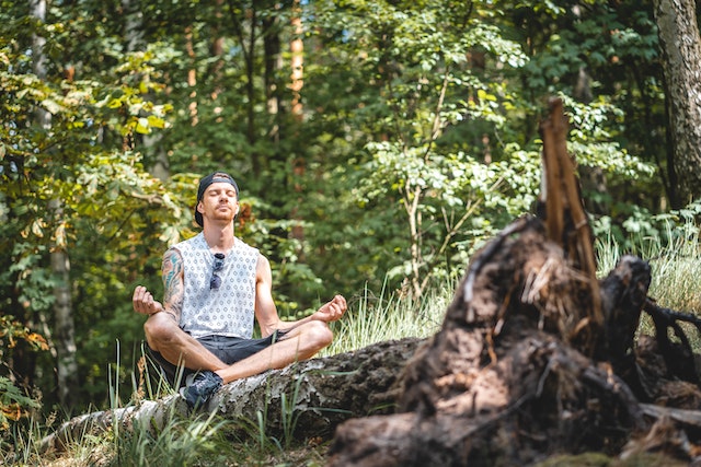 Photo by Maik Kleinert: https://www.pexels.com/photo/man-meditating-on-a-tree-log-3576284/