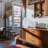 Photo by Charlotte May: https://www.pexels.com/photo/elegant-table-lamps-placed-on-wooden-cabinet-in-stylish-room-with-windows-in-sunlight-5824527/