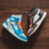 Photo by Erik Mclean: https://www.pexels.com/photo/brown-and-blue-sneakers-on-a-wooden-floor-7543641/