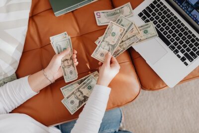 Photo by Karolina Grabowska: https://www.pexels.com/photo/close-up-of-woman-counting-dollar-bills-5902919/