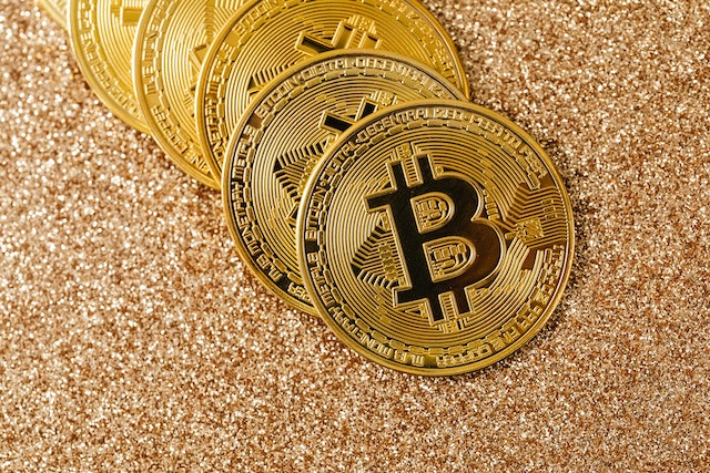 Photo by Karolina Grabowska: https://www.pexels.com/photo/gold-round-coins-on-gold-glittery-surface-5980573/