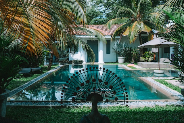 Photo by ROMAN ODINTSOV: https://www.pexels.com/photo/outdoor-swimming-pool-in-tropical-garden-4870581/
