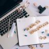Photo by Leeloo Thefirst: https://www.pexels.com/photo/blue-pills-and-scrabble-tiles-on-a-planner-7163950/